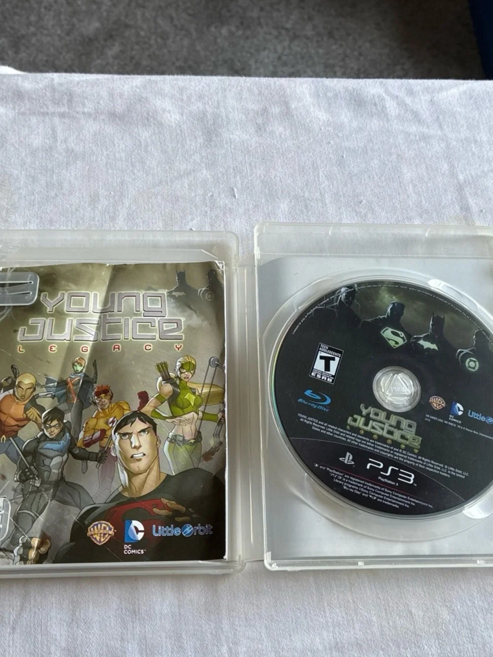Justice Young Justice Legacy PS3 Game Cover — Green, Black, Gray, Blue